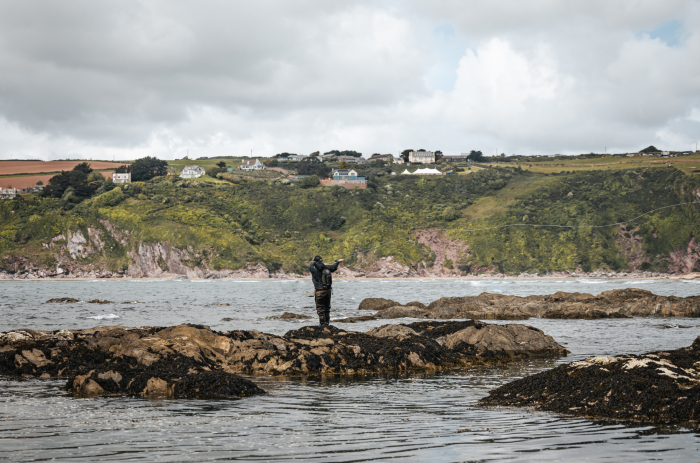 Jon Dyson casts off from the rocks using his Snowbee Spectre Pro Fly Rod