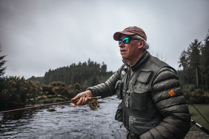 Snowbee ambassador Simon Kidd fly fishing with Snowbee tackle on a Devon river during a guided fishing session