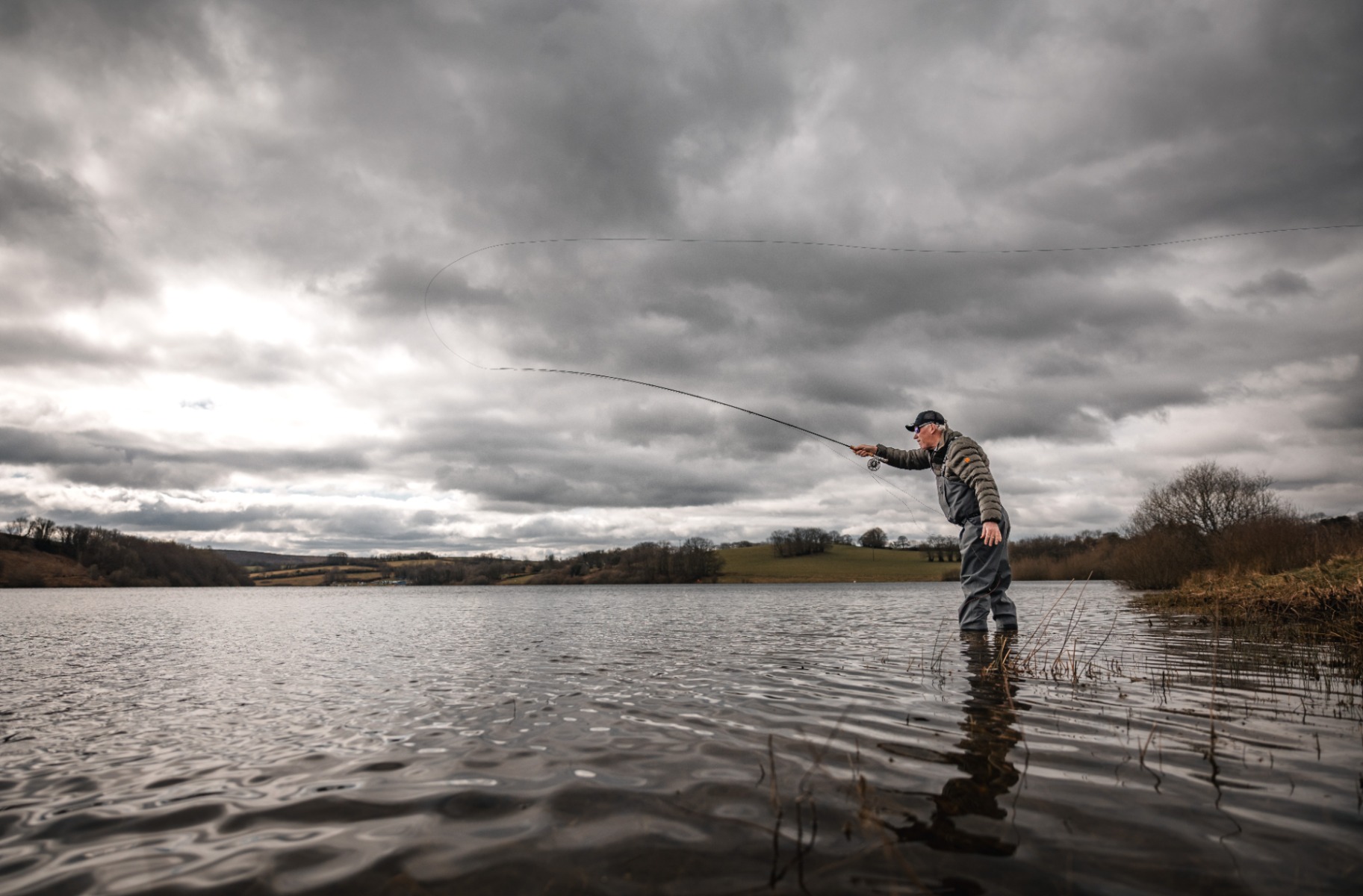 Simon Kidd demonstrates some more advanced fishing tactics during a fly fishing coaching session