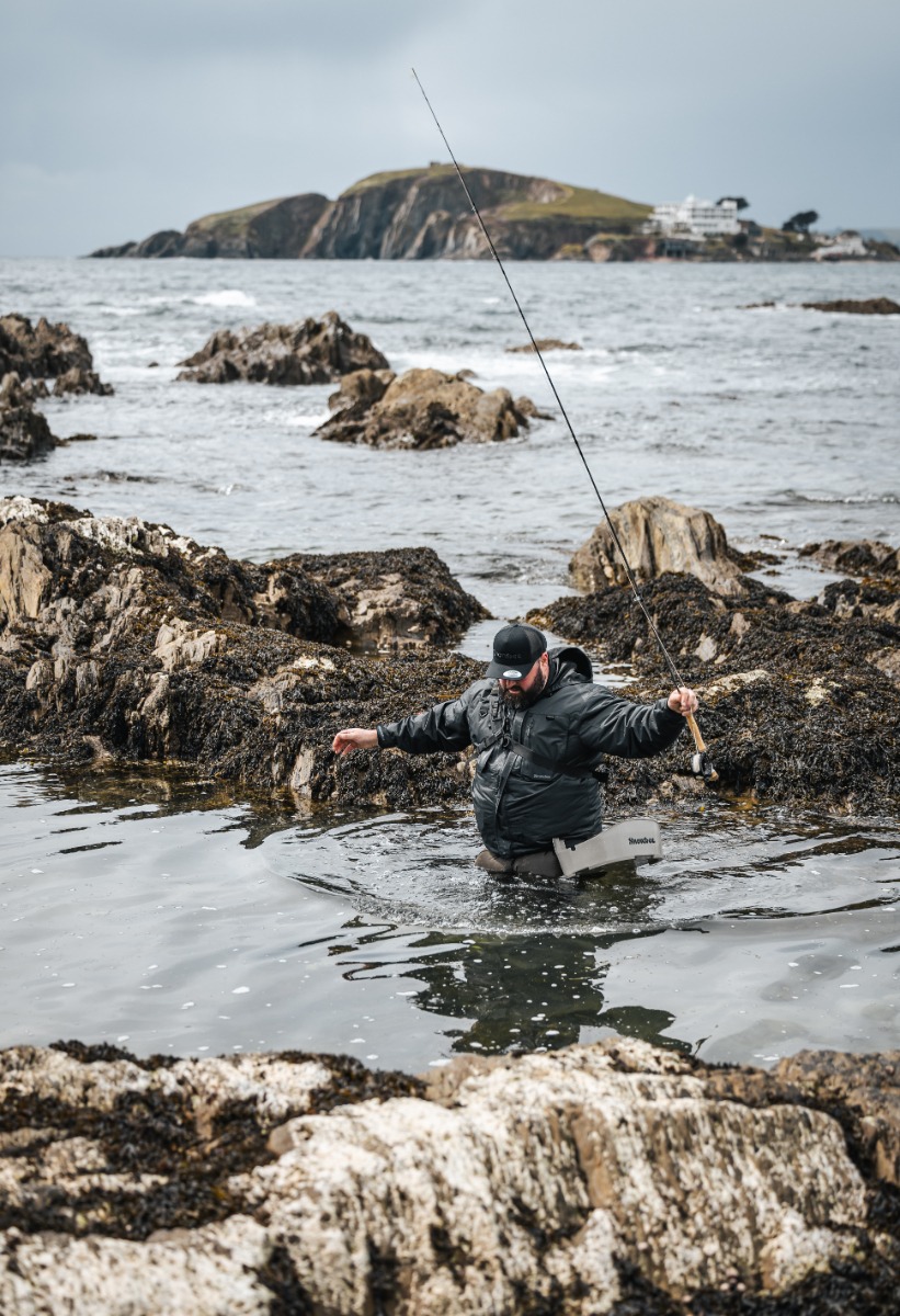 Jon Dyson Wades through the rocky Devon coastline to find a good spot to cast from